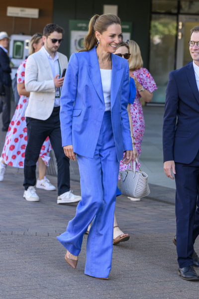 Kate Middleton walking in a blue suit